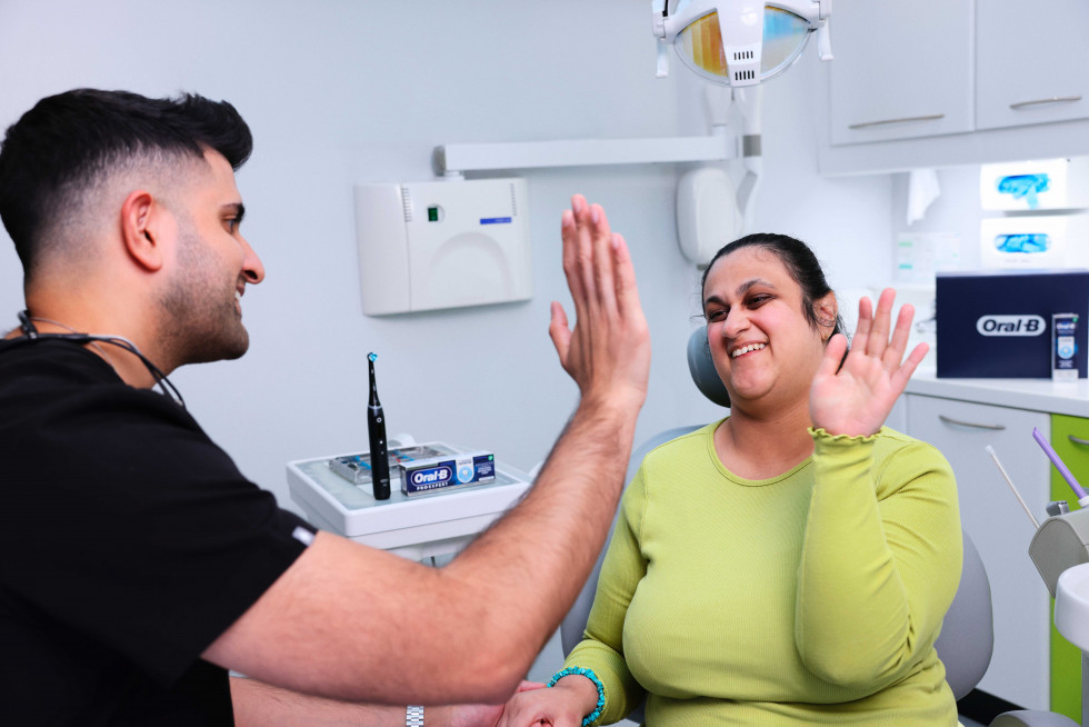 Dr Vikas Prinja with a patient in his dental practice in London, and one of the first dental professionals to become a Disability Champion